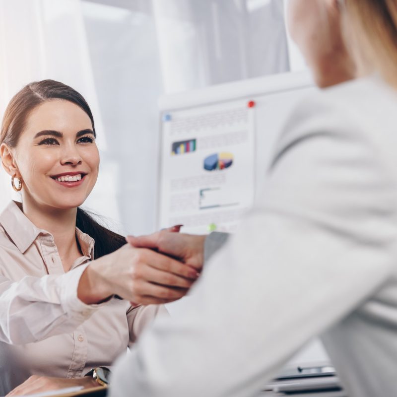 recruiter-smiling-and-shaking-hands-with-employee-at-job-interview-in-office.jpg interview